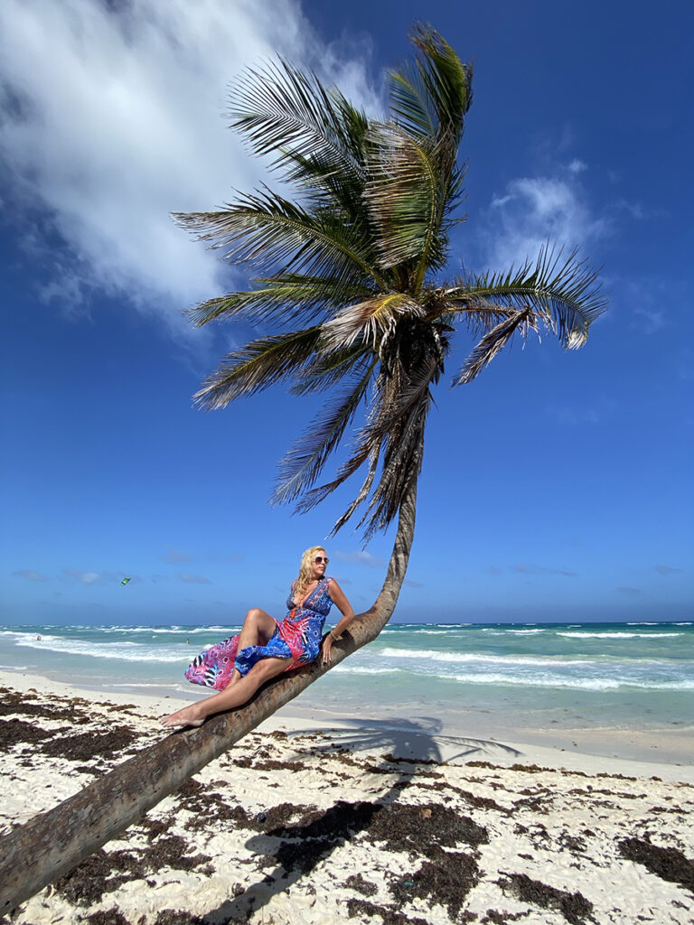 Allison Melody takes a tree-hugging break on the beach in Tulum, Mexico