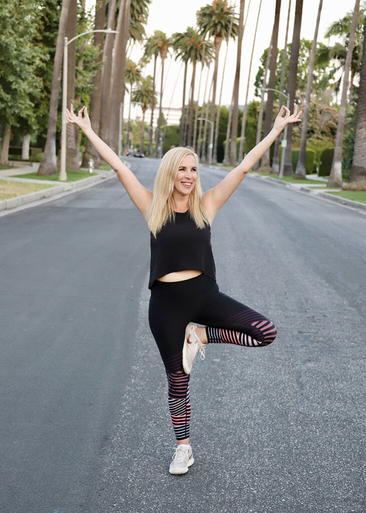 Food Heals Podcast Host Allison Melody takes a quick yoga break in Beverly Hills, CA